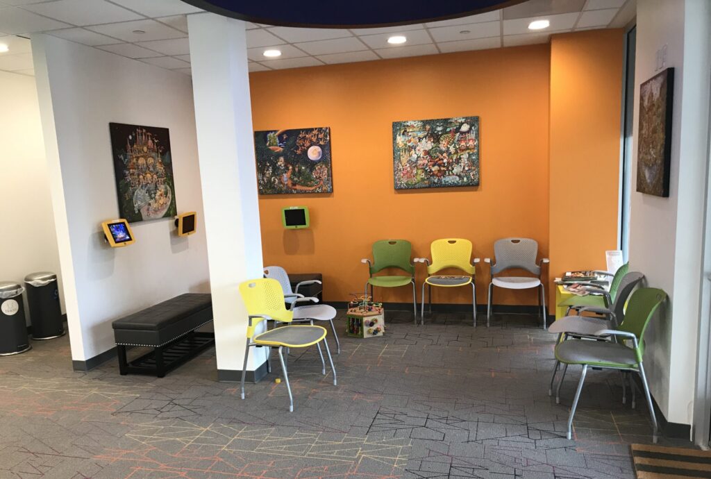 Waiting area with ipads to engage kids
